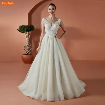 Elegáns elefántcsont V nyakú esküvői ruha rátétes gyöngyfűző női menyasszonyi ruhák fehér tüll gyár egyedi Vestido De Noiva Princesa